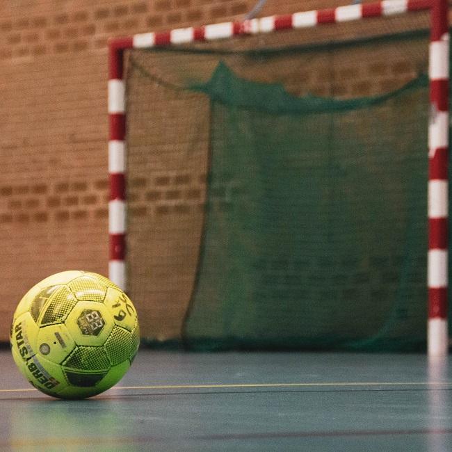 yellow and black soccer ball on field-otuM-nw-_NY-unsplash  pascal-swier 650.jpg