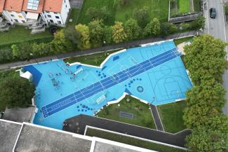 Aerial shot of blue square playground in Balzers, Liechtenstein