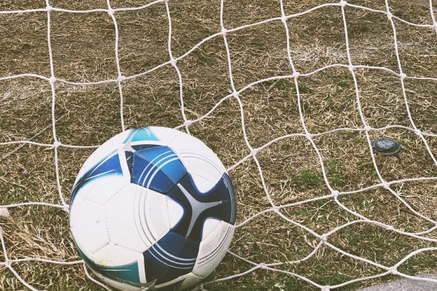 ball lying in net 6TL-WevCdgk-unsplash_brandi-ibrao 